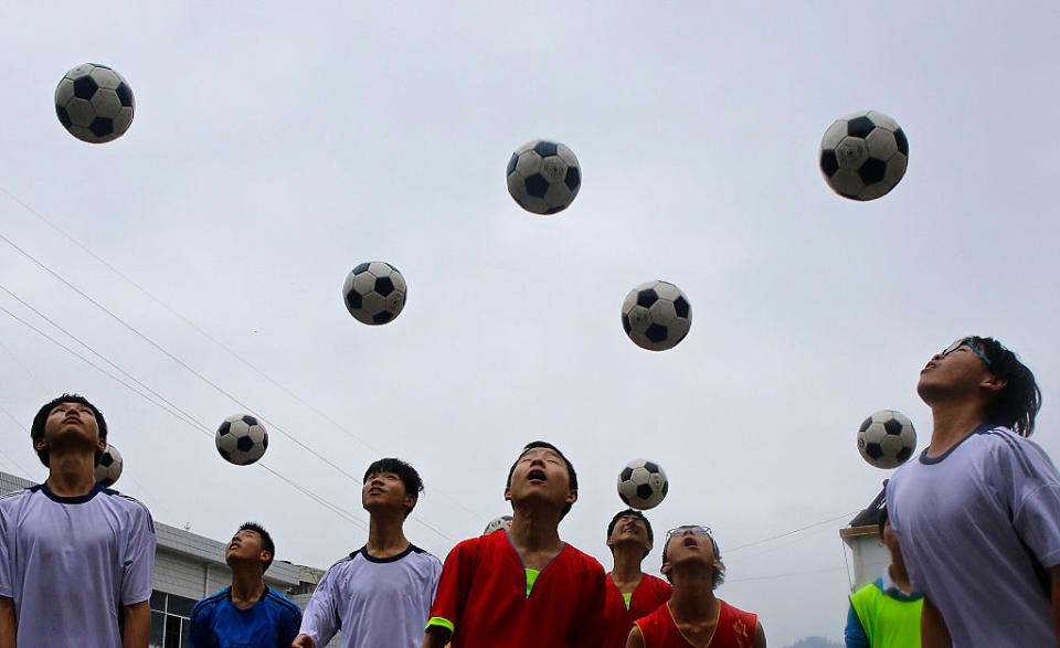 Chinese students are seen during a football training session in the campus of the Yuyang Middle School in Wufeng Tujia Nationality Autonomous County of Yichang on June 1, 2016, in Hubei province, China.<span class="copyright">Getty Images—2016 Wang He</span>