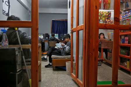 Youths gather in an internet gaming centre in the capital city of Thimphu, Bhutan, December 11, 2017. REUTERS/Cathal McNaughton