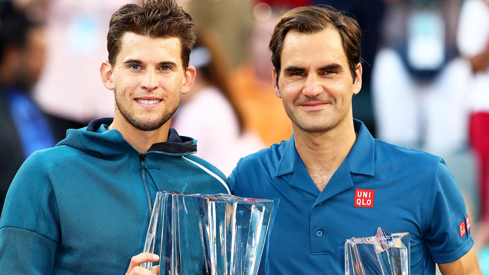 Dominic Thiem holds the championship trophy after his victory against Roger Federer. (Photo by Clive Brunskill/Getty Images)