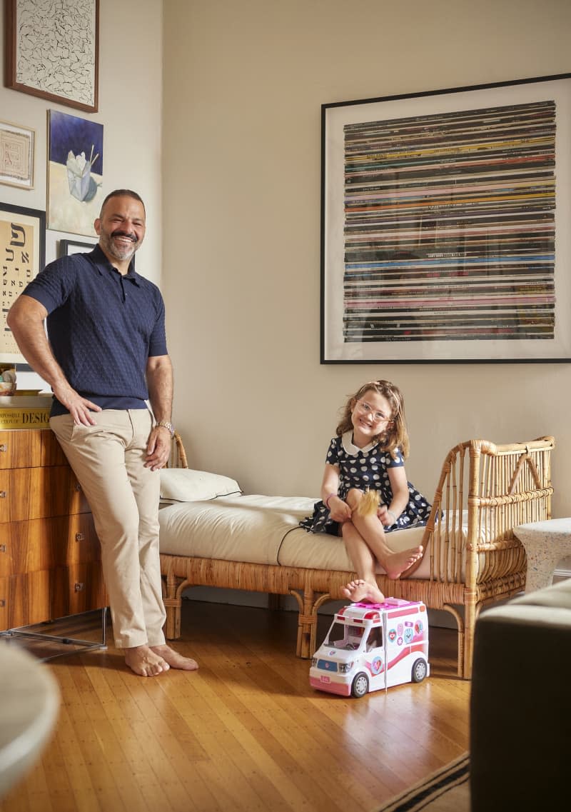 Dwellers pose in their studio apartment.