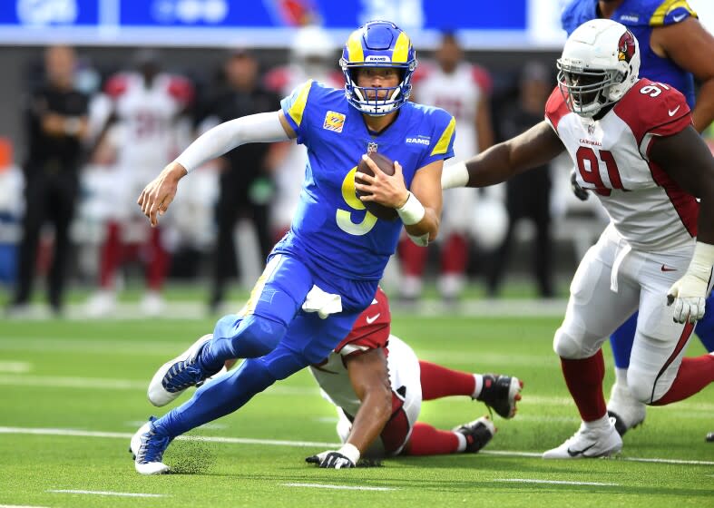 Inglewood, CA. October 3, 2021: Rams quarterback Matthew Stafford scrambles.