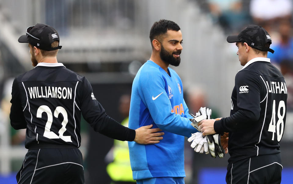 MANCHESTER, ENGLAND - JULY 10:  Virat Kohli shake hands with Tom Latham of New Zealand after the Semi-Final match of the ICC Cricket World Cup 2019 between India and New Zealand after weather affected play at Old Trafford on July 10, 2019 in Manchester, England. (Photo by Michael Steele/Getty Images)