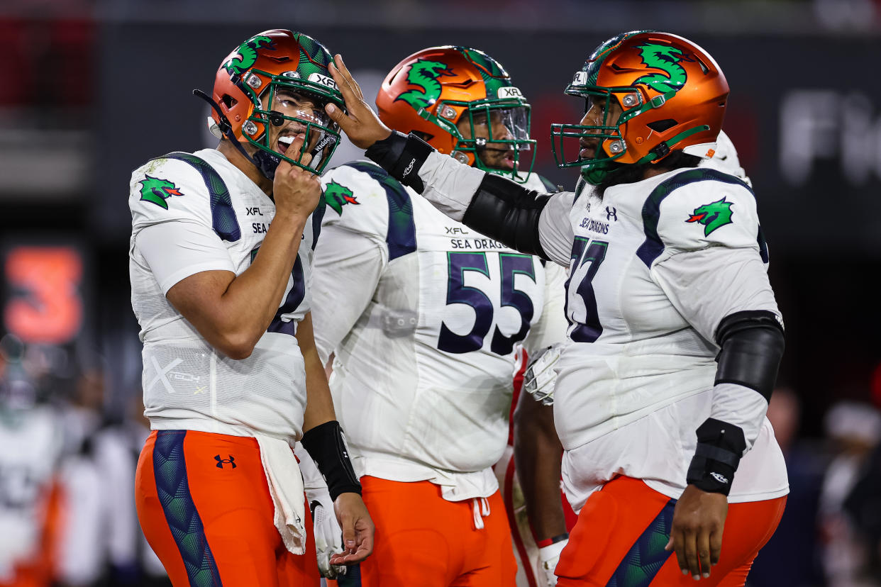 WASHINGTON, DC - FEBRUARY 19: Steven Montez #12 of the Seattle Sea Dragons reacts after being hit on a play against the DC Defenders during the first half of the XFL game at Audi Field on February 19, 2023 in Washington, DC. (Photo by Scott Taetsch/Getty Images)