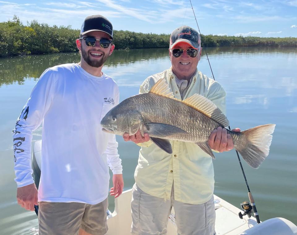 Bill LaPierre (right), of New Smyrna Beach, with grandson Billy and an oversized black drum they caught in Southeast Volusia. It measured 27 inches and the max is 24, so they tossed it back and, Bill says, they were later rewarded with three keeper drum.
