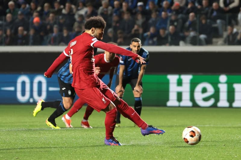 Liverpool's Mohamed Salah scores his side's first goal from a penalty spot during the UEFA Europa League, quarter-final second leg match between Atalanta and Liverpool at the Gewiss Stadium. Jonathan Moscrop/CSM via ZUMA Press Wire/dpa