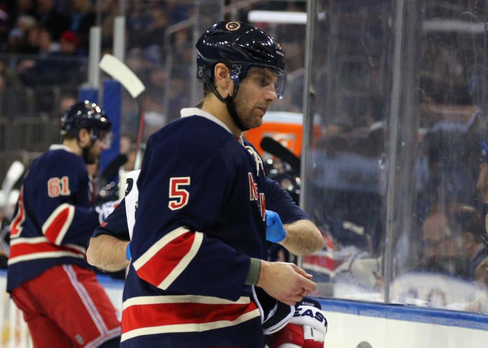 NEW YORK, NY - JANUARY 11: Dan Girardi #5 of the New York Rangers leaves the ice with an injury during the second period against the Boston Bruins at Madison Square Garden on January 11, 2016 in New York City.  (Photo by Bruce Bennett/Getty Images)