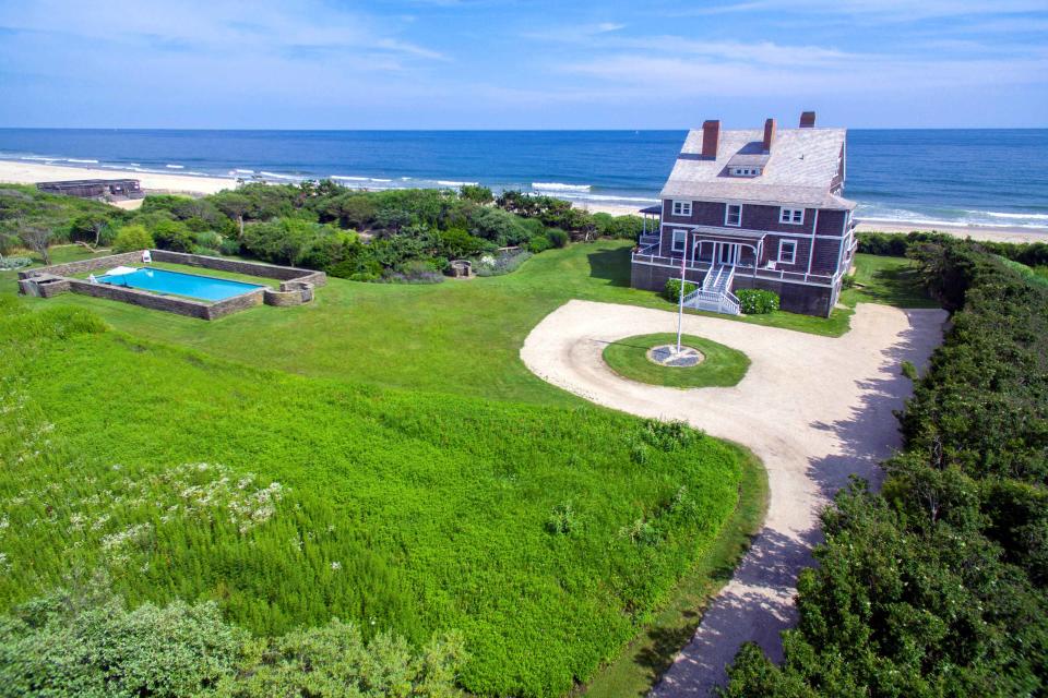 3) There's a 60-foot outdoor pool enclosed with a stone wall.