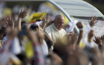 FILE - In this July 12, 2015, file photo, Pope Francis arrives to celebrate a mass in Asuncion, Paraguay. Across the globe, Pope Francis’ comments endorsing same-sex civil unions were received by some as encouragement for an advancing struggle and condemned by others as an earth-shaking departure from church doctrine. (AP Photo/Natacha Pisarenko, File)