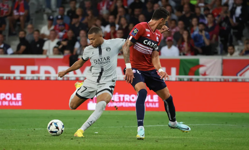 LILLE, FRANCE - AUGUST 21: Kylian Mbappe #7 of Paris Saint-Germain scores his third goal during the Ligue 1 match between Lille OSC and Paris Saint-Germain at Stade Pierre-Mauroy on August 21, 2022 in Lille, France. (Photo by Xavier Laine/Getty Images)