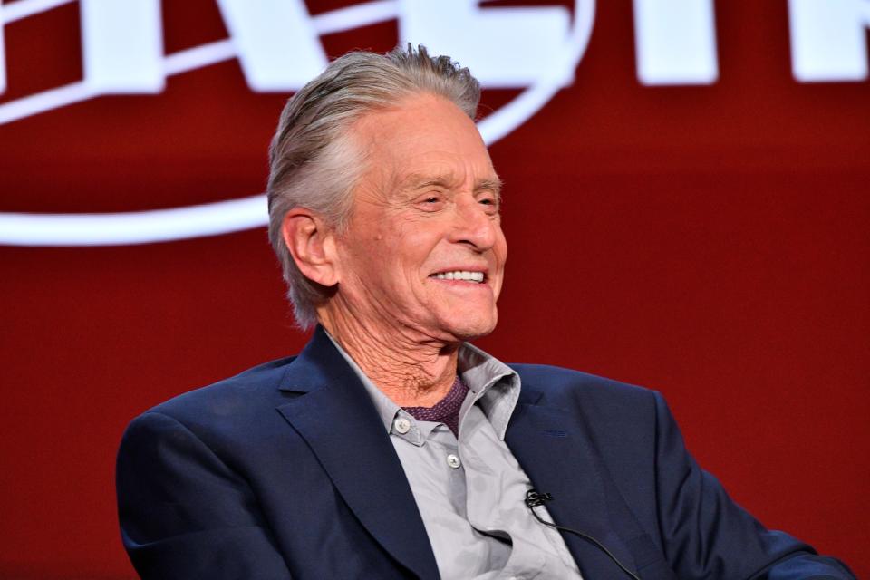 Michael Douglas speaks on stage about his new series "Franklin" during a press event.