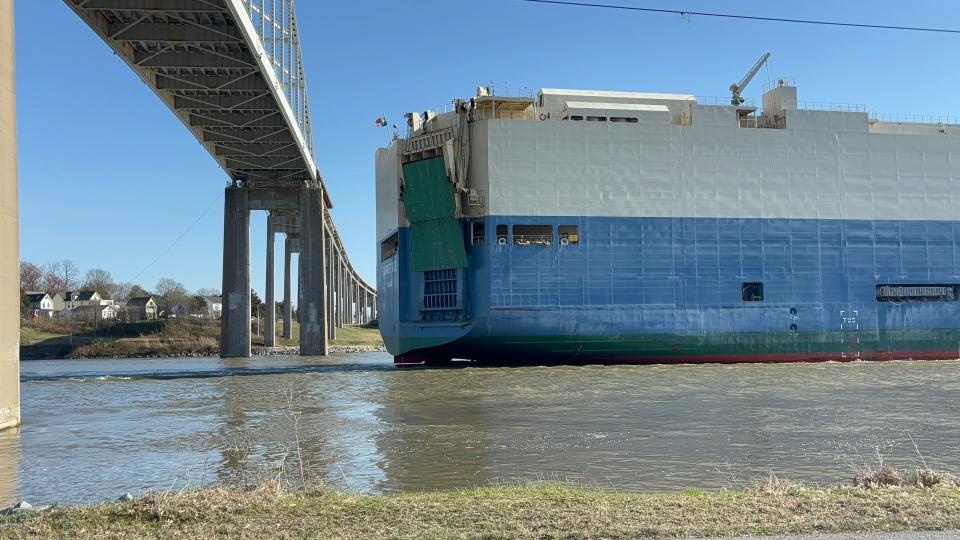 A ship passes under the St. Georges Bridge, near St. Georges, in 2024.