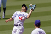 Los Angeles Dodgers shortstop Kiké Hernández makes a catch on a ball hit by San Francisco Giants' Mike Yastrzemski during the third inning of a baseball game Sunday, Aug. 9, 2020, in Los Angeles. (AP Photo/Mark J. Terrill)