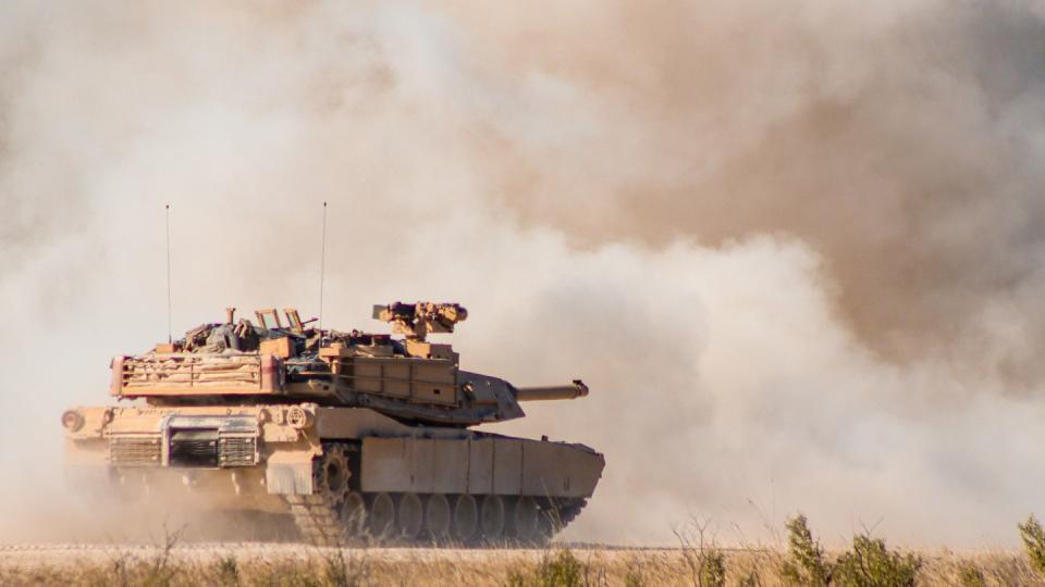 An M1A2 SEPv3 Abrams Main Battle Tank with Apache Company, 1st Battalion 9th Cavalry Regiment, 2ABCT, 1st Cavalry Division stands behind dust it has picked after firing its 120mm main gun at Fort Hood, Texas, on October 4th, 2022. (Army)