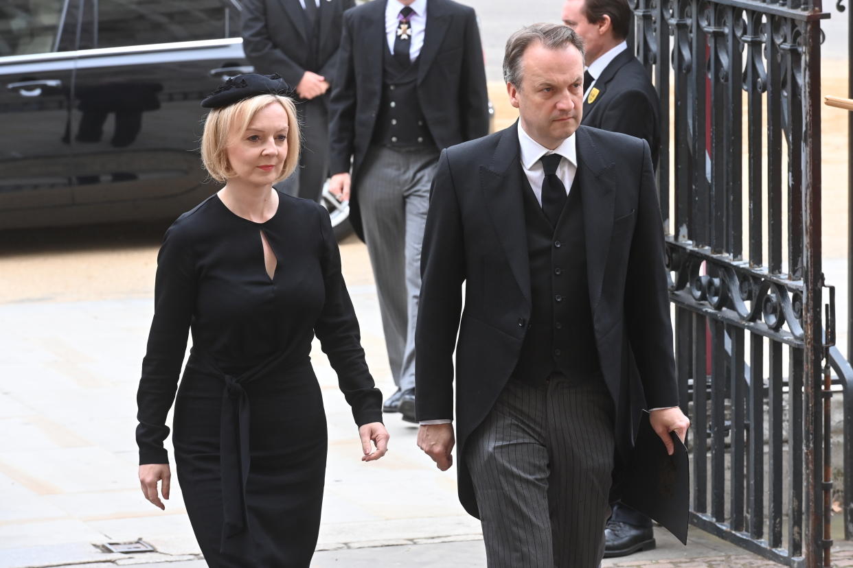 Prime Minister Liz Truss and husband Hugh O'Leary arriving at Westminster Abbey for Queen Elizabeth's funeral. (PA)