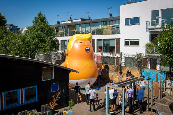 The Trump Baby sitting team give the six meter high inflatable Trump Baby his first London outing inside the disused North London playground, Islington, London, United Kingdom on June 26, 2018. The plan, is to fly him above Parliament Square in Westminster when U.S. President Donald Trump arrives in the United Kingdom on July 13, 2018. (photo by Andrew Aitchison / In pictures via Getty Images)