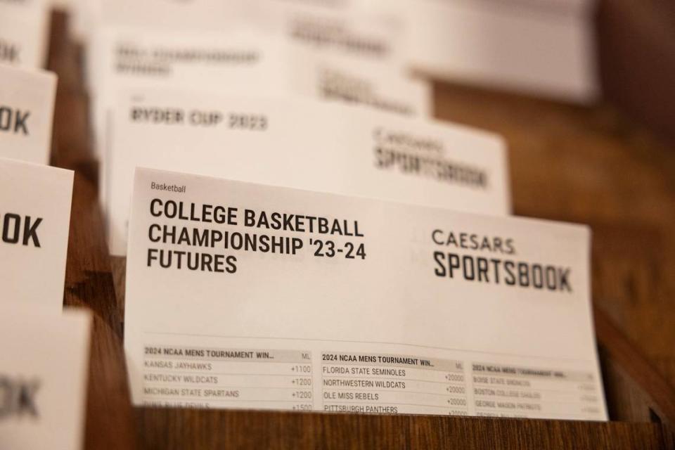 College basketball betting sheets from Caesars Sportsbook are on display at Red Mile in Lexington. In-person sports gambling began in Kentucky this month, with mobile wagering available in the state Thursday.