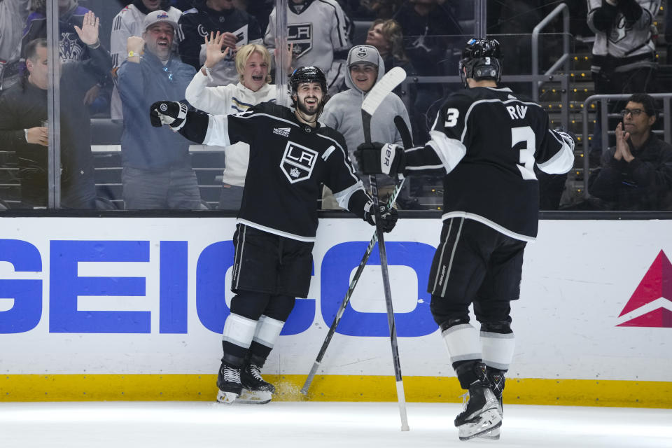 Los Angeles Kings center Phillip Danault celebrates his goal with defenseman Matt Roy during the second period of an NHL hockey game against the New Jersey Devils, Sunday, March 3, 2024, in Los Angeles. (AP Photo/Ryan Sun)