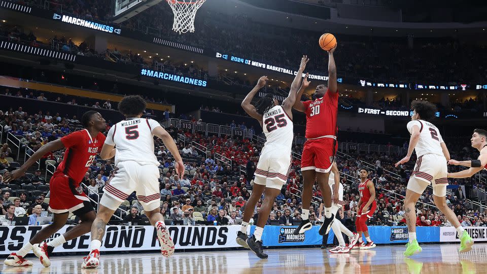 Burns shoots against over Robert Jennings of the Texas Tech Red Raiders during the first half in the first round of the 2024 men's March Madness. - Tim Nwachukwu/Getty Images North America/Getty Images
