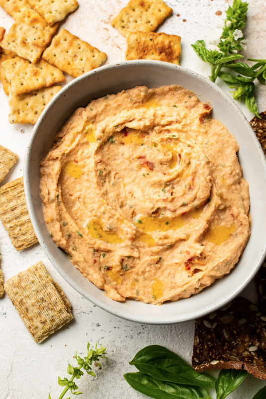 <p>Salt and Lavender</p><p>This sun-dried tomato and basil white bean dip is silky, healthy, and full of flavor. It's ready in under 10 minutes!</p><p><strong>Get the recipe: <a href="https://www.saltandlavender.com/sun-dried-tomato-and-basil-white-bean-dip/" rel="nofollow noopener" target="_blank" data-ylk="slk:Sun Dried Tomato and Basil White Bean Dip;elm:context_link;itc:0;sec:content-canvas" class="link rapid-noclick-resp"><em>Sun Dried Tomato and Basil White Bean Dip</em></a></strong></p>