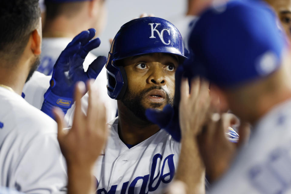 Kansas City Royals' Carlos Santana is congratulated by teammates in the dugout after hitting a two-run home run during the fifth inning of a baseball game against the Baltimore Orioles in Kansas City, Mo., Thursday, June 9, 2022. (AP Photo/Colin E. Braley)