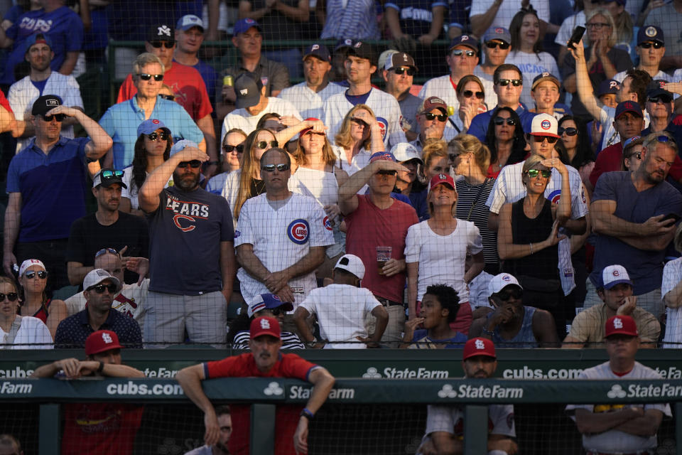 Fans watch a baseball game between the St. Louis Cardinals and the Chicago Cubs during the seventh inning in Chicago, Sunday, June 13, 2021. (AP Photo/Nam Y. Huh)