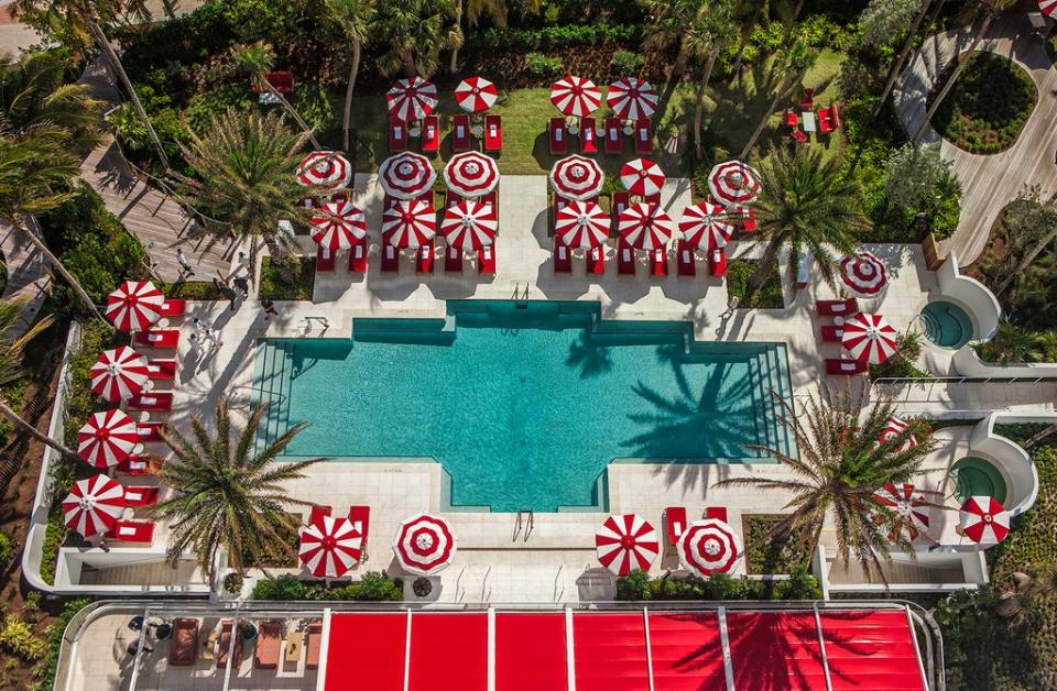 Sweet relaxation with candy cane-themed poolside parasols (Faena Hotel Miami Beach)