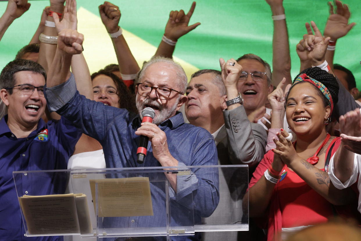 Luiz Inacio Lula da Silva, Brazil's former president and president-elect, center, addresses supporters after winning the runoff presidential election in Sao Paulo, Brazil, October 30, 2022. / Credit: Tuane Fernandes/Bloomberg/Getty