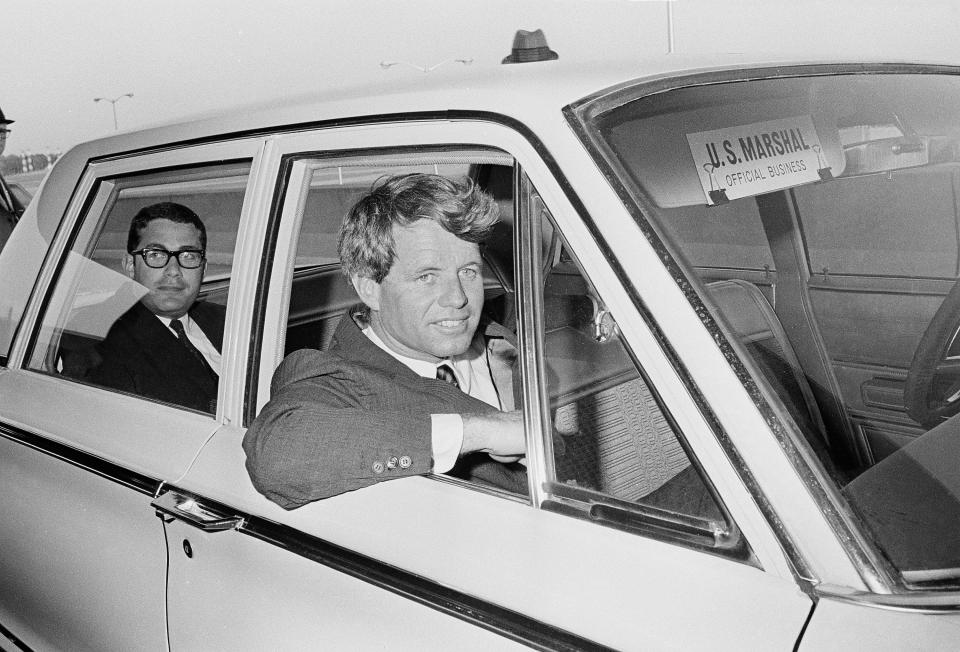 <p>Sen. Robert F. Kennedy sits in a U.S. Marshall car after his arrival at the Jackson, Miss., airport for an antipoverty hearing, April 10, 1967. (Photo: Jack Thornell/AP) </p>