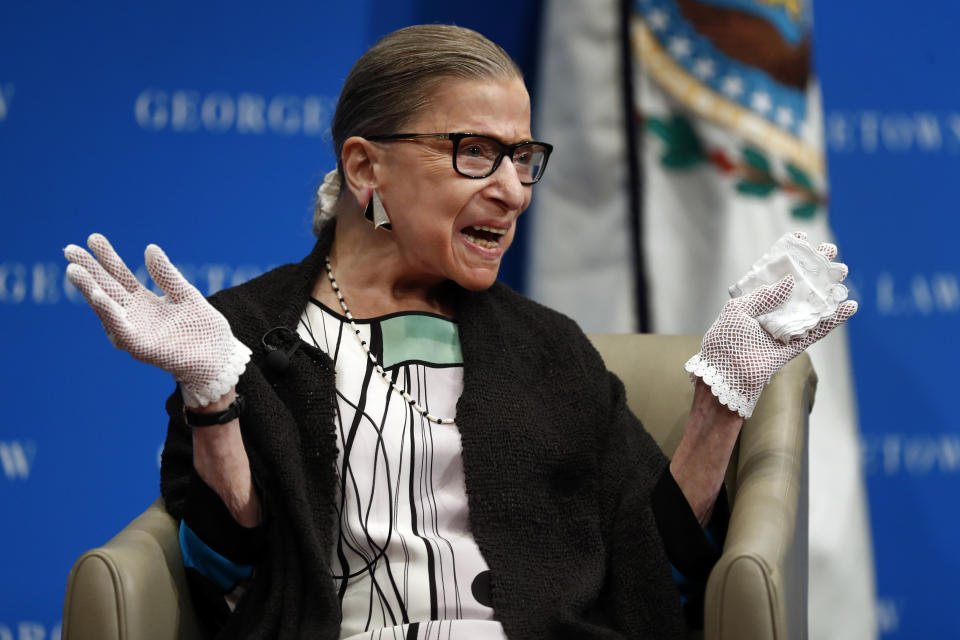 FILE - In this Sept. 20, 2017 file photo, U.S. Supreme Court Justice Ruth Bader Ginsburg reacts to applause as she is introduced by William Treanor, Dean and Executive Vice President of Georgetown University Law Center, at the Georgetown University Law Center campus in Washington. On Friday, Sept. 24, 2020, The Associated Press reported on stories circulating online incorrectly claiming Ginsburg wanted to lower the age of consent for sex to 12 years old. This bogus claim first emerged during Ginsburg’s 1993 confirmation hearings when official testimony misinterpreted a recommendation by Ginsburg in a 1977 report published by the United States Commission on Civil Rights. (AP Photo/Carolyn Kaster, File)