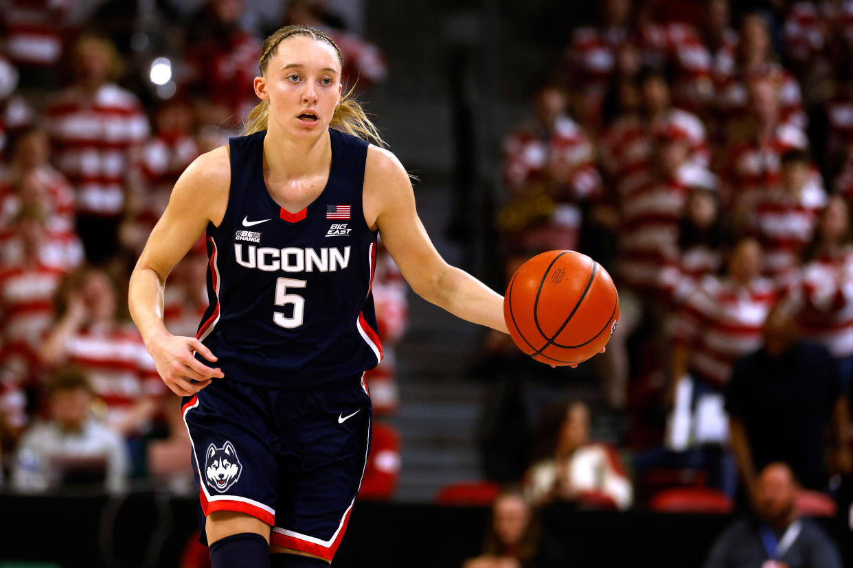 UConn's Paige Bueckers dribbles up court against NC State during the first half at Reynolds Coliseum in Raleigh, North Carolina, on Nov. 12, 2023. (Photo by Lance King/Getty Images)