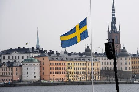 Flag at half mast at the official ceremony at Stockholm City Hall with one minute of silence at noon to remember the victims of Friday's terror attack on Drottninggatan, Stockholm, Monday, April 10, 2017. TT NEWS AGENCY/Anders Wiklund via REUTERS