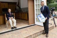 <p>David Beckham pays a socially distanced visit to Sir Tom Moore — who <a href="https://people.com/human-interest/99-year-old-war-veteran-raises-19-million-walking-100-laps-uk-healthcare/" rel="nofollow noopener" target="_blank" data-ylk="slk:completed dozens of laps in his backyard garden;elm:context_link;itc:0;sec:content-canvas" class="link ">completed dozens of laps in his backyard garden</a> in the spring to raise nearly $40 million for the U.K.’s National Health Service — to announce he's been chosen to captain the England Lionhearts squad of everyday heroes on Thursday in Bedfordshire, England.</p>