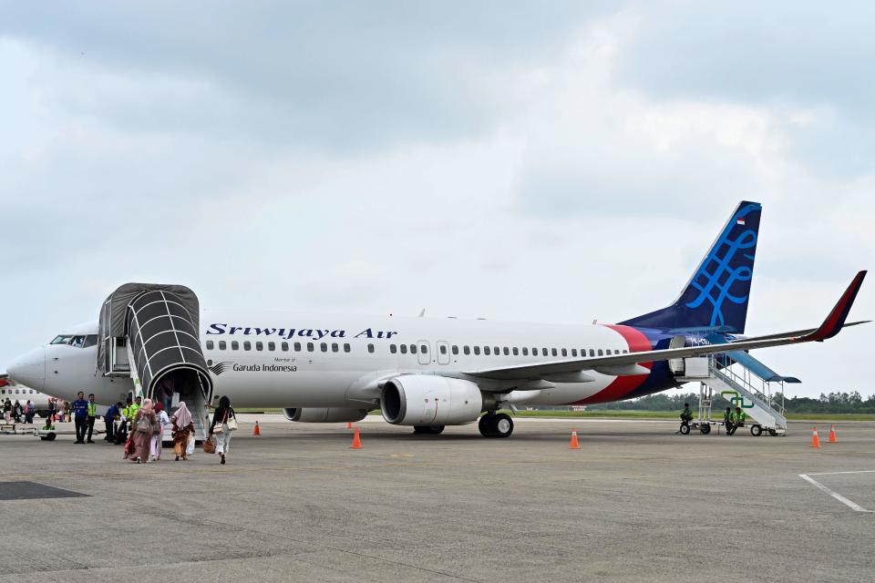 Passengers boarding a Sriwijaya Air Boeing 737-800 aircraft at the airport in Padang, West Sumatra.