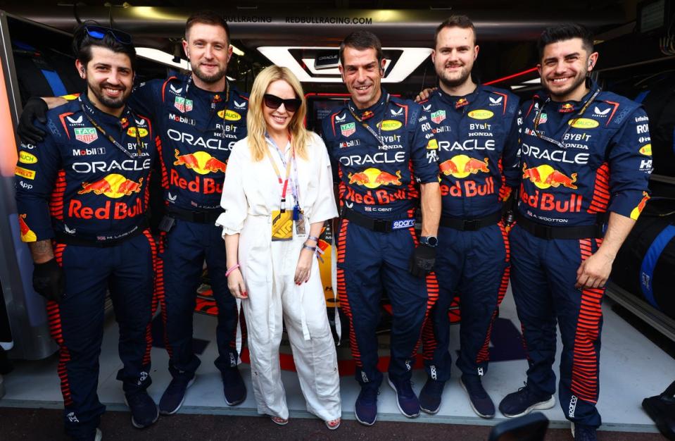 Kylie Minogue and Red Bull Racing team members pose for a photo in the garage during the F1 Grand Prix of Monaco at Circuit de Monaco on May 28, 2023 (Getty Images)