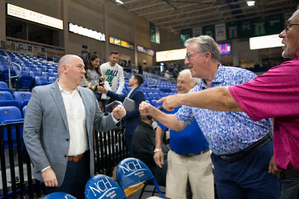 Florida Gulf Coast Eagles head coach Michael Fly speaks with supporters after defeating the Detroit Mercy Titans 95-79 in the first round of The Basketball Classic presented by Eracism, Wednesday, March 16, 2022, at Alico Arena in Fort Myers, Fla.