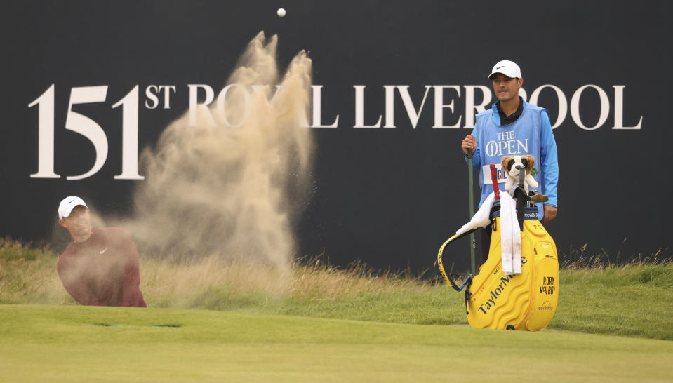 Northern Ireland's Rory McIlroy plays out of a bunker on the 18th green during a practice round for the British Open Golf Championships at the Royal Liverpool Golf Club in Hoylake, England, Tuesday, July 18, 2023. The Open starts Thursday, July 20. (AP Photo/Peter Morrison)