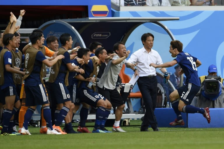 Japan's second goal scorer Yuya Osako and coach Akira Nishino in high spirits