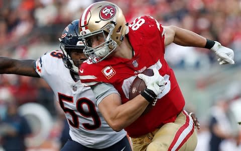 San Francisco 49ers tight end George Kittle (85) runs against Chicago Bears inside linebacker Danny Trevathan (59) during the second half of an NFL football game in Santa Clara - Credit: AP