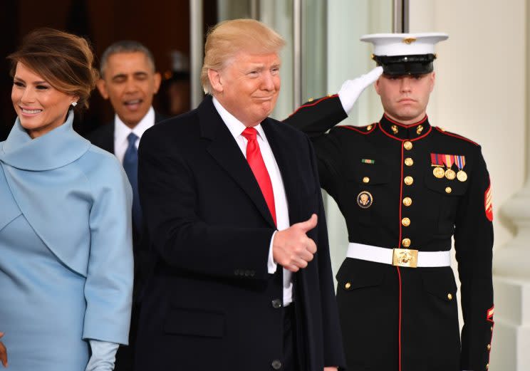 Donald Trump and wife Melania Trump arrive at the White House as President Obama looks on before the inauguration