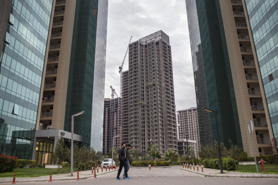 A new development is seen in Irbil, Iraq, Tuesday, March 21, 2023. The Kurdish in Iraq region won de facto self-rule in 1991 when the United States imposed a no-fly zone over it in response to Saddam's brutal repression of Kurdish uprisings. With American invasion 20 years ago much of Iraq fell into chaos, as occupying American forces fought an insurgency and as multiple political and sectarian communities vied to fill the power vacuum left in Baghdad. But the Kurds, seen as staunch allies of the Americans, strengthened their political position and courted foreign investments. (AP Photo/Hawre Khalid, Metrography)