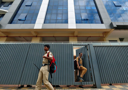 Policemen come out of one of the closed call centres in Mira-Bhayander, on the outskirts of Mumbai, India October 6, 2016. REUTERS/Danish Siddiqui/File photo