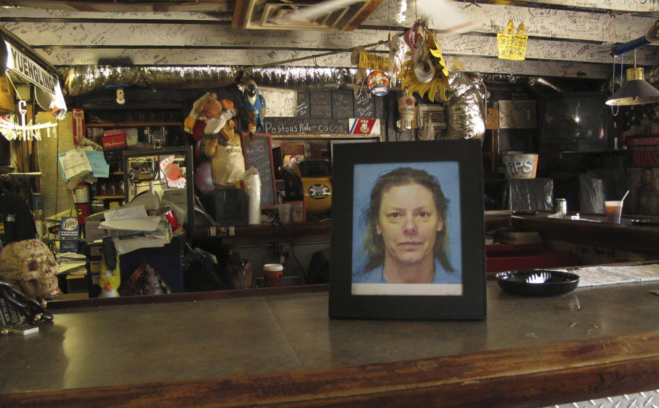 In this May 3, 2012 photo, a photo of serial killer Aileen Wuronos sits on the counter at the Last Resort Bar in Port Orange, Fla. Almost 22 years after Wuornos was arrested at The Last Resort, the curious still come to the place where she had her last drink. (AP Photo/Brendan Farrington)