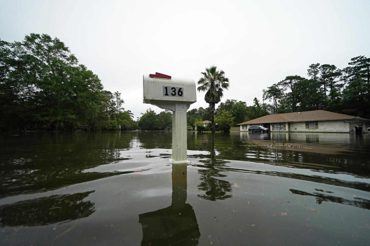 Water from Tropical Storm Claudette floods a neighborhood after the storm passed through Slidell, La., on June 19, 2021. (Gerald Herbert / AP)