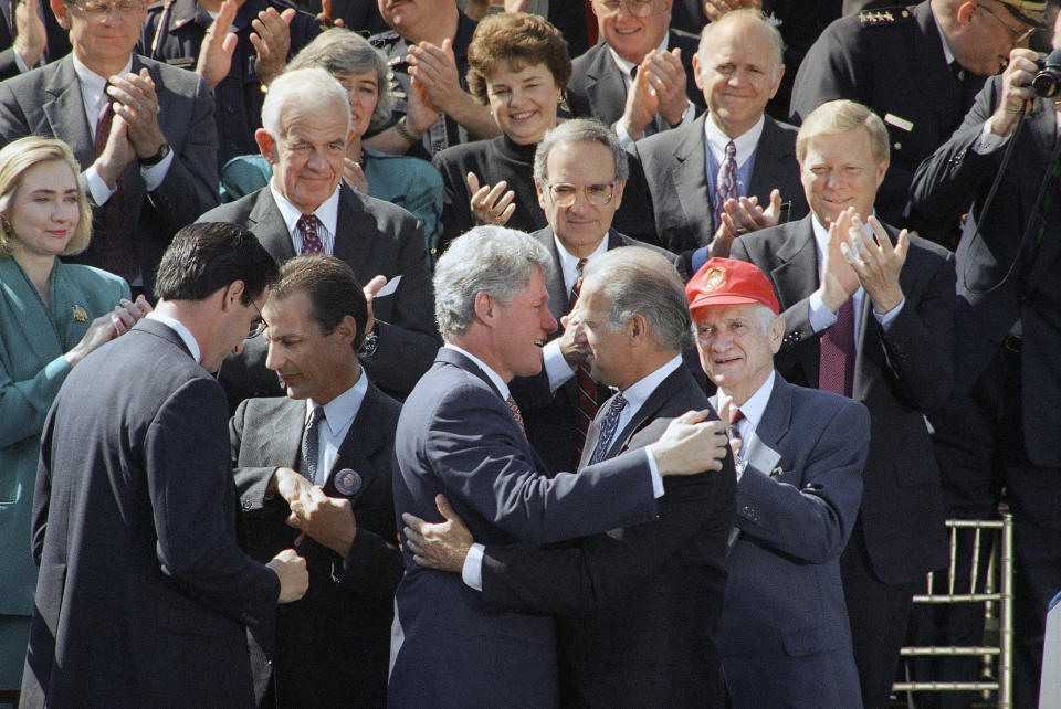 President Bill Clinton hugs then-Sen. Joe Biden in 1994 after signing the Violent Crime Control Act.&nbsp; (Photo: ASSOCIATED PRESS)