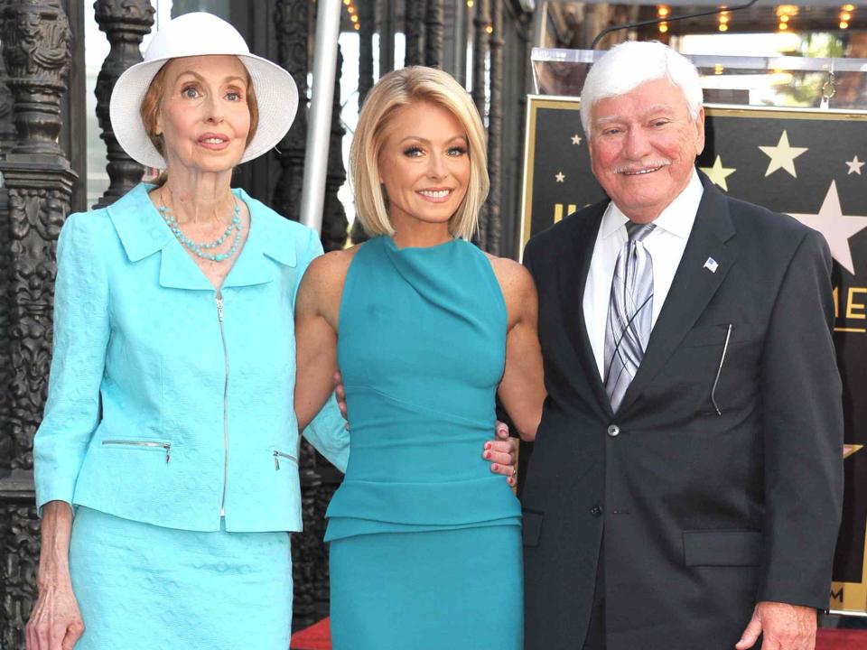 <p>Steve Granitz/WireImage</p> Kelly Ripa with her parents as she is honored with a star on the Hollywood Walk Of Fame on Oct. 12, 2015 in Hollywood, California.