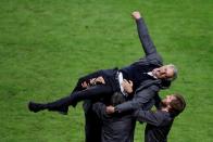 FILE PHOTO: Manchester United manager Jose Mourinho celebrates with coaching staff after the club's 2-0 victory over Ajax Amsterdam in the Europa League final in Stockholm.