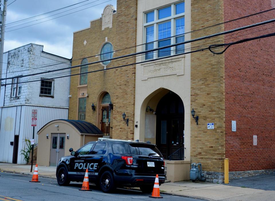 A Hagerstown Police officer sits in a patrol vehicle outside Congregation B'nai Abraham in Hagerstown on Sunday. The minister of economic affairs from the Israeli embassy in Washington, D.C., arrived shortly later to address the local Jewish congregation about the Oct. 7, 2023, Hamas attack on Israel.