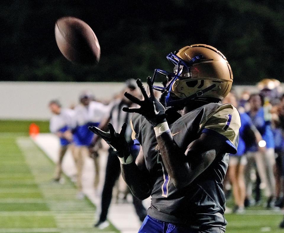 Mainland's Ajai Harrell (1) makes the catch for  the score during play with Flagler Palm Coast at Daytona Stadium in Daytona Beach, Monday, Sept.19, 2022.