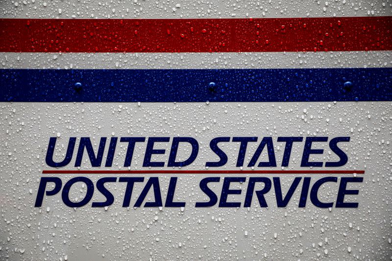 FILE PHOTO: A United States Postal Service (USPS) truck is seen in the rain in Manhattan during outbreak of coronavirus disease (COVID-19) in New York