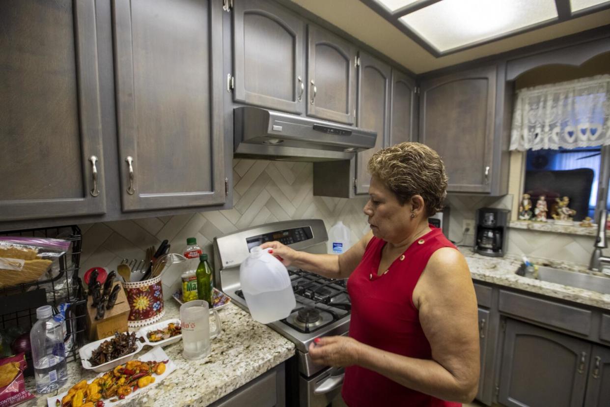 Maria Olivera, who is living with chromium and arsenic in her well and is showering with contaminated water.